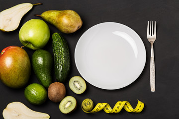 Healthy eating, dieting, slimming and weigh loss concept. Fruits and vegetables on rustic wooden backround with space for text. Diet concept