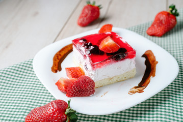 Fresh baked cake with strawberry jelly topping.