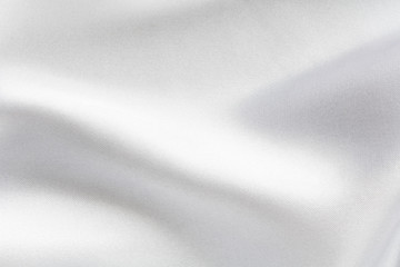Background of white fabric with large folds