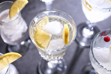 Different refreshing cocktails on table