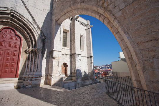 Old church in Lisbon. Arch over the aisle. Exit to the observation deck. Bright sunlight

