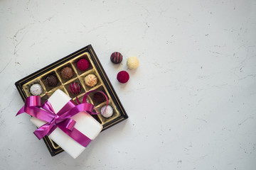 Truffle chocolate and present. Holiday background. Top view