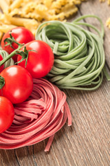 pasta and vegetables on wooden table
