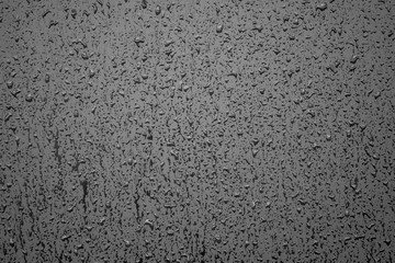 raindrops on gloss black wall