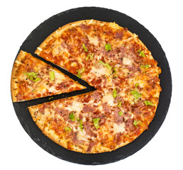 Pizza with ham and cheese on black stone