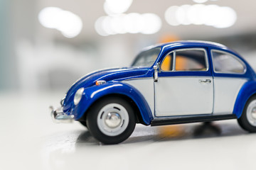 Happy kid at home with oldtimer car toy