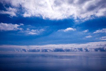 blue sky, white clouds and calm blue sea, blue and white sea scape