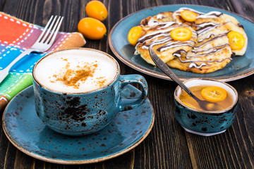 Cappuccino and fritters for breakfast
