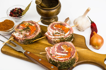 Raw meat rolls on wooden skewers for frying