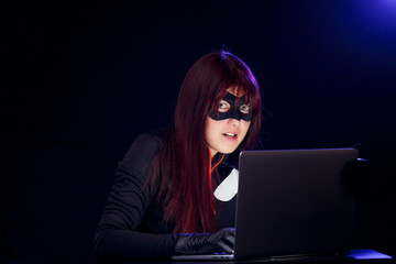 Dangerous hacker in mask close-up
