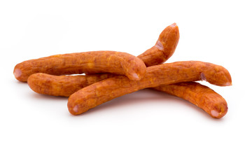 Stack of smoked sausages isolated on a white background.