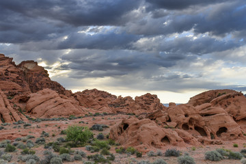 Dramatic Morning Clouds Over Rocky Desert Landscape