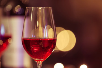 Glass of red wine on restaurant table. 
