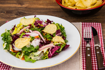 Fresh salad mix with ham and chips