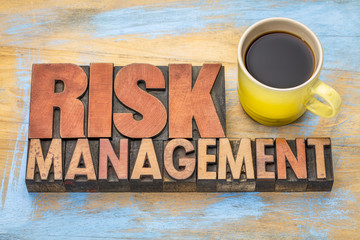 risk management banner in wood type