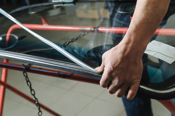 Repair and replacement of the windshield of the car.