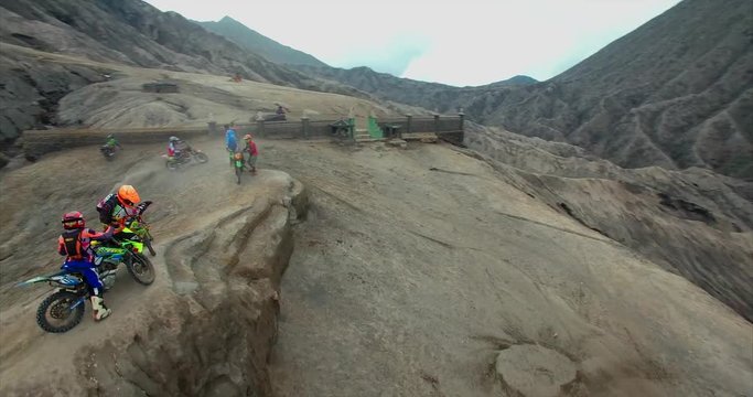Bike in caldera Bromo Volcano. Racing on mountains, Motocross footage by drone