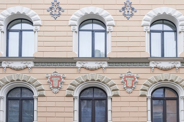 Fototapeta na wymiar House wall with moulding in Riga