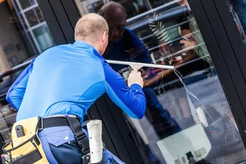 window washer working  at building outdoor © Coka