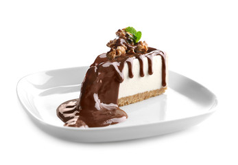Plate with delicious cheesecake slice on white background