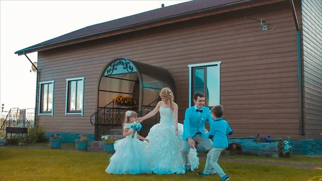 Family Celebration in Green Courtyard of House Slow Motion