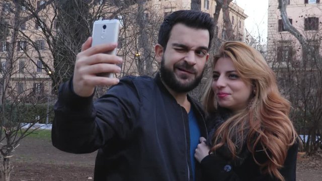 funny lovers Taking A Selfie in the park,portrait