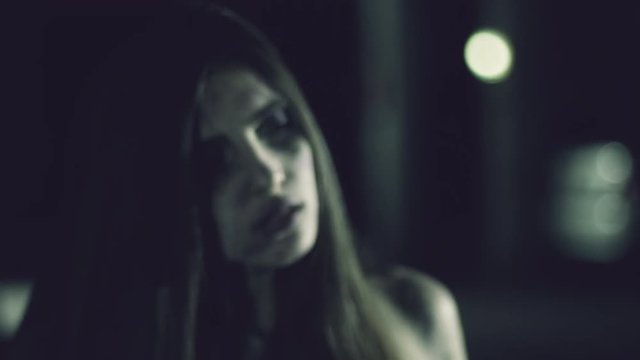 Female zombie watching man attacking angry