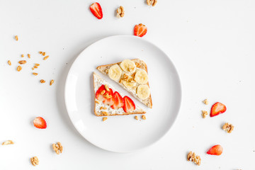 sandwiches set in plates on white table background top view