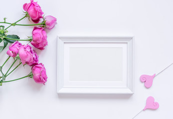 present design with peony bouquet and white frame top view mock up