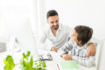 Man and boy on computer