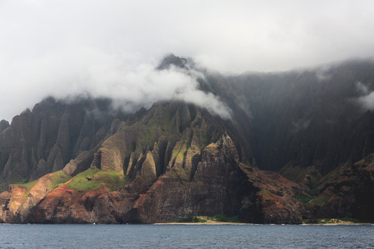 View of rocky coastline during fog