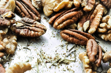 Healthy mixed nuts - walnut and pecan with rosemary
