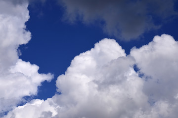 Naklejka na ściany i meble Cumulus white clouds in the blue sky