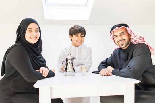 Happy Arabic Family At Dining Room