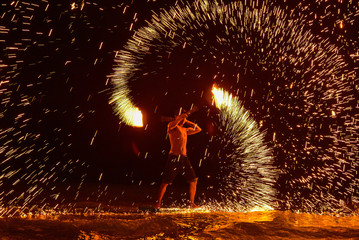Fire dancing shows at night on the beach, Samed island, Rayong, Thailand.Amazing fire show on the beach.Fire boy show at Koh Samed.