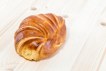 Croissant Brioche on a pine wood table