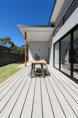 Large outdoor decking and high entertaining  table in a new home