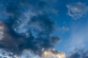 Obraz premium Blue sky with dark clouds as background