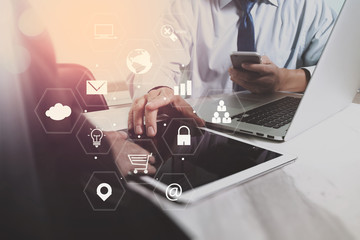 co working team meeting concept,businessman using smart phone and laptop and digital tablet computer in modern office with virtual interface icons network diagram