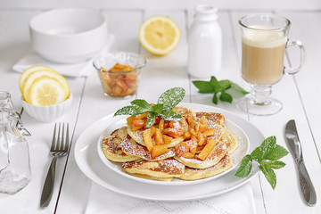 Pancakes with apple, honey and cinnamon with coffee for beautiful breakfast