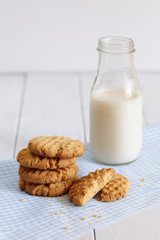 Biscuits with milk on wood background in the morning
