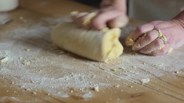 close up on italian housewife hands knead the dough