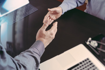 Medical and healthcare concept,Doctor and patient shaking hands in modern office at hospital