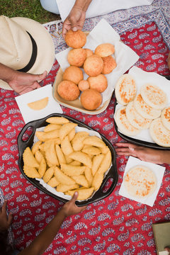 summer day picnic blanket - empanadas, arepas  and bunuelos - traditional southamerican food