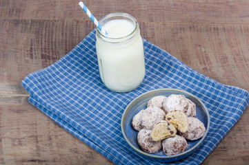 Rolled and sugared cookies with milk