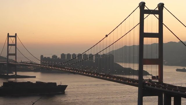 Container Ship Across the Tsing Ma Bridge at Dusk, HongKong.