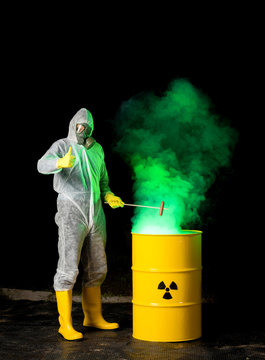biohazard worker grilling sausage over radioactive green smoke coming out from yellow barrel