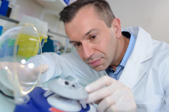 scientist carrying out experiment