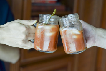Two hands toasting (cheers!)