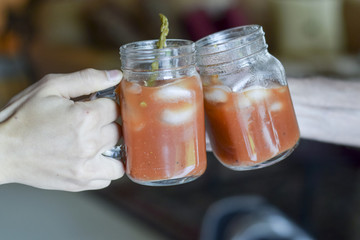 Two hands toasting (cheers!)